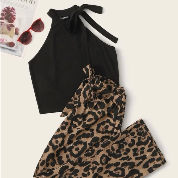 Super cute outfit never been worn. Black top with cheetah print pants.